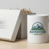 Sublimation mug with logo and tagline next to premium packaging box