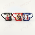 A collection of three Personalized Heart Handle Magic Mugs in matte red, blue, and black finishes displayed on a clean white surface